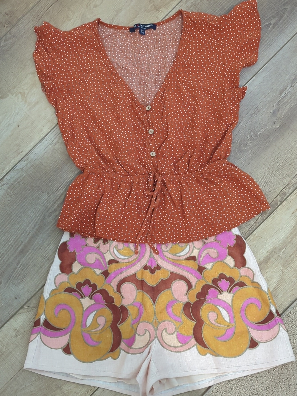 one clothing Rust Polka Dot Peplum Button-Front Top